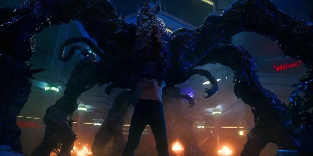 Stranger Things (2019) movie still: fullbody — A multi-level shopping mall interior contains a massive organic monster with numerous dark tentacles.…