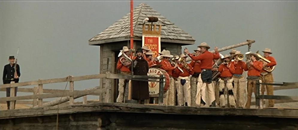 Buffalo Bill and the Indians, or Sitting Bull’s History Lesson (1976) movie still: wide — A group of men in western attire performs music on a…