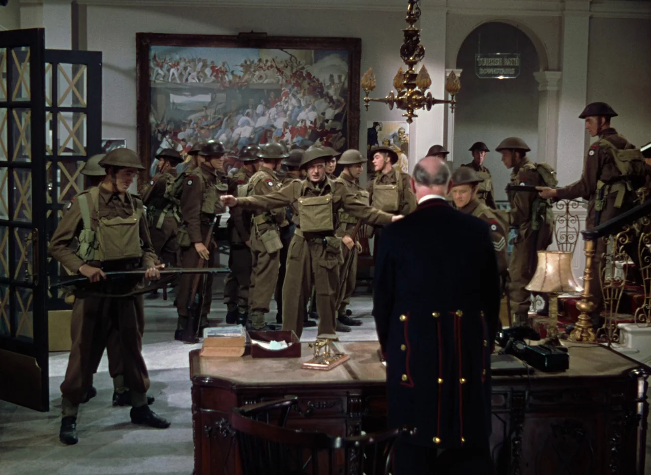The Life and Death of Colonel Blimp (1943) movie still: fullbody — A hotel lobby with high ceilings, a large oil painting, and period architectural…