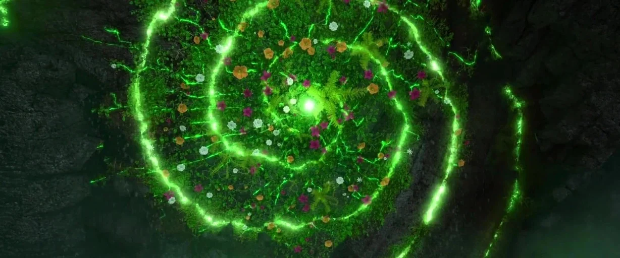 Moana (2016) movie still: establishing — A dark, rocky area features a central point of light surrounded by floral growth. Vibrant green magical…