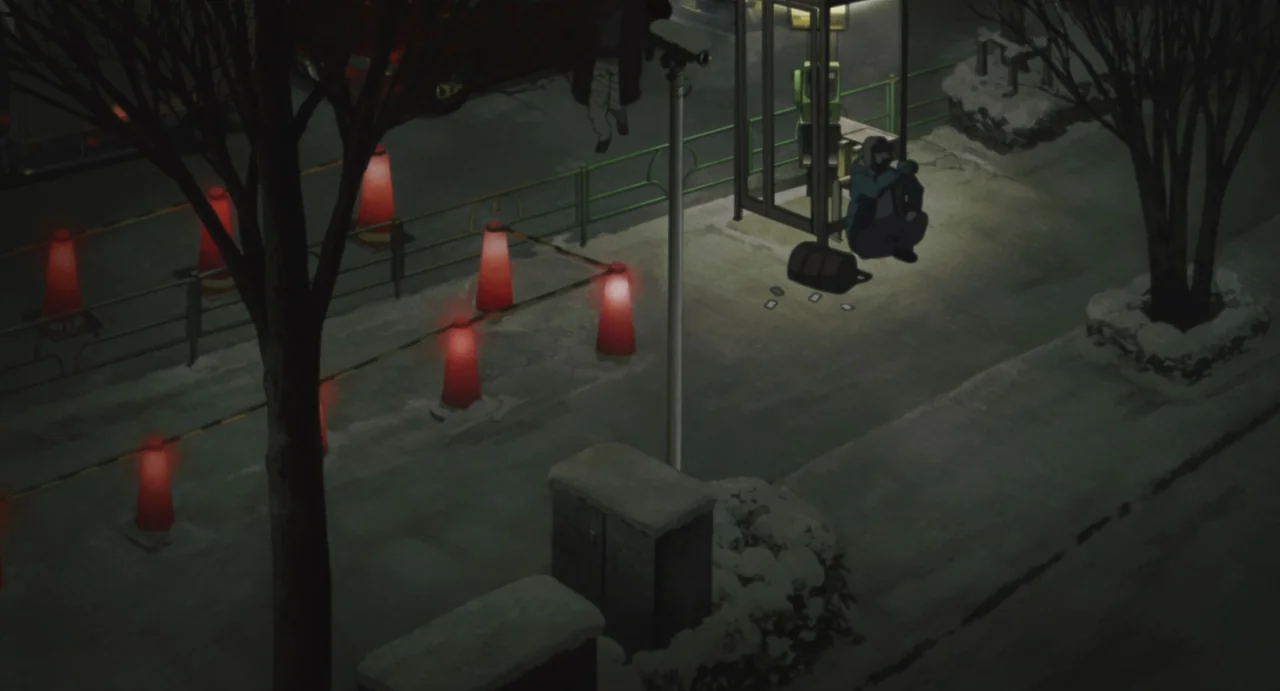 Tokyo Godfathers (2003) movie still: wide — A snow-dusted urban sidewalk at night features red warning cones marking a section. A lone person in a…