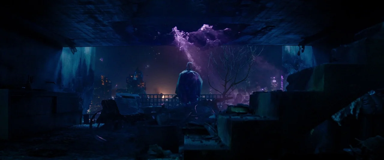 Deadpool 2 (2018) movie still: wide — A dark, dilapidated room with a large jagged hole in the concrete ceiling. An elderly man stands alone in the…