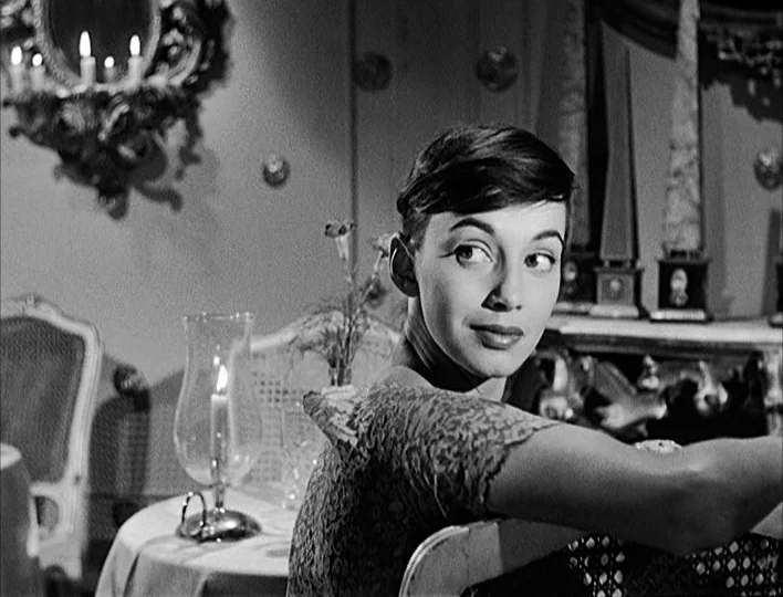 Nights of Cabiria (1957) movie still: medium — A refined interior space with ornate mirrors and furniture visible in the background. A woman with…