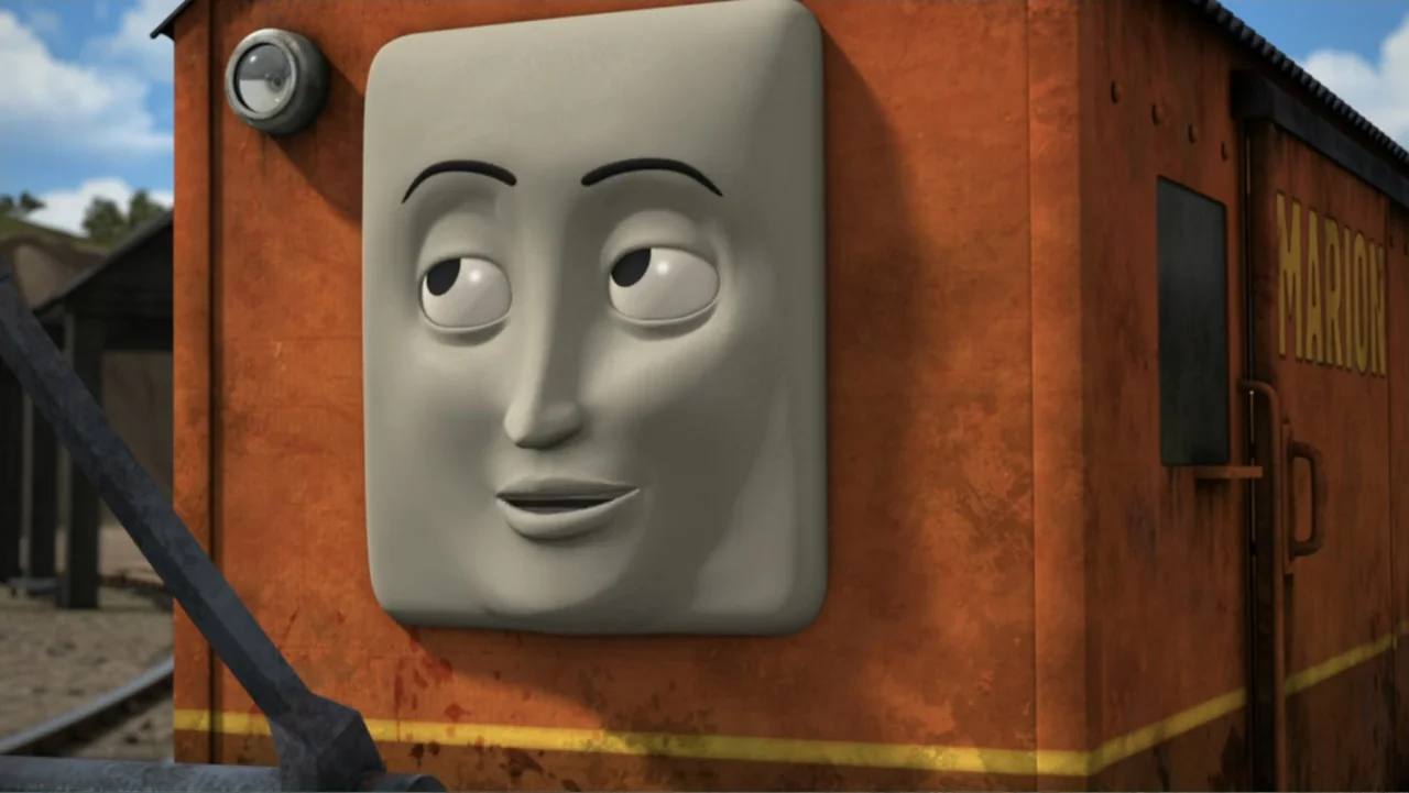 Thomas & Friends: Tale of the Brave (2014) movie still: closeup — An orange weathered railway vehicle face stands prominently in a sunny outdoor…