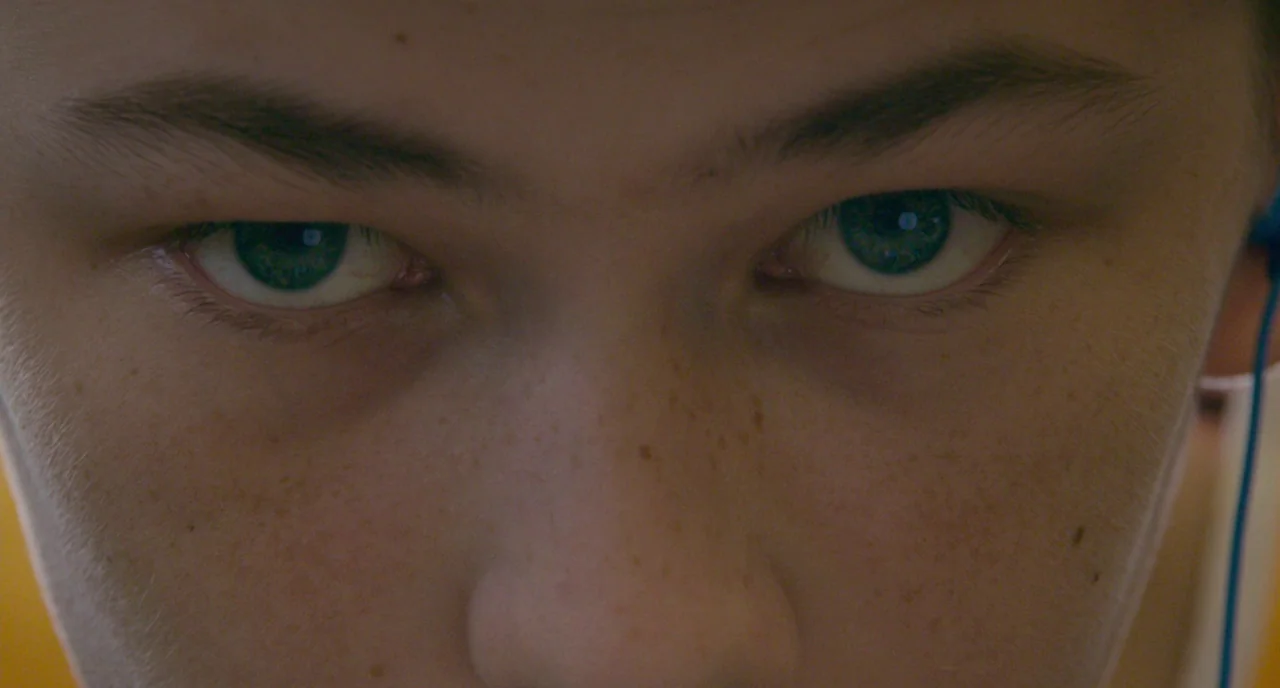 Eighth Grade (2018) movie still: closeup — A close-up view of a teenager's eyes and bridge of the nose. The subject looks directly into the camera…