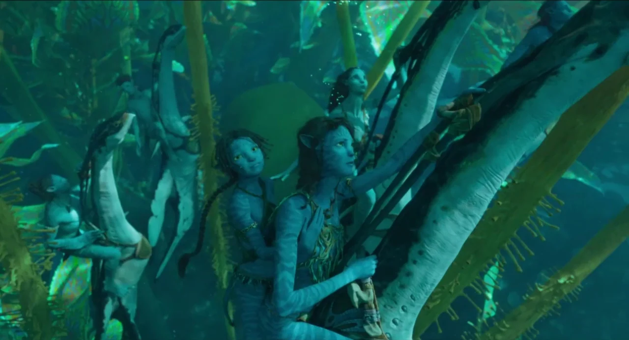 Avatar: The Way of Water (2022) movie still: medium — An underwater ecosystem with large bioluminescent aquatic creatures and several blue-skinned…