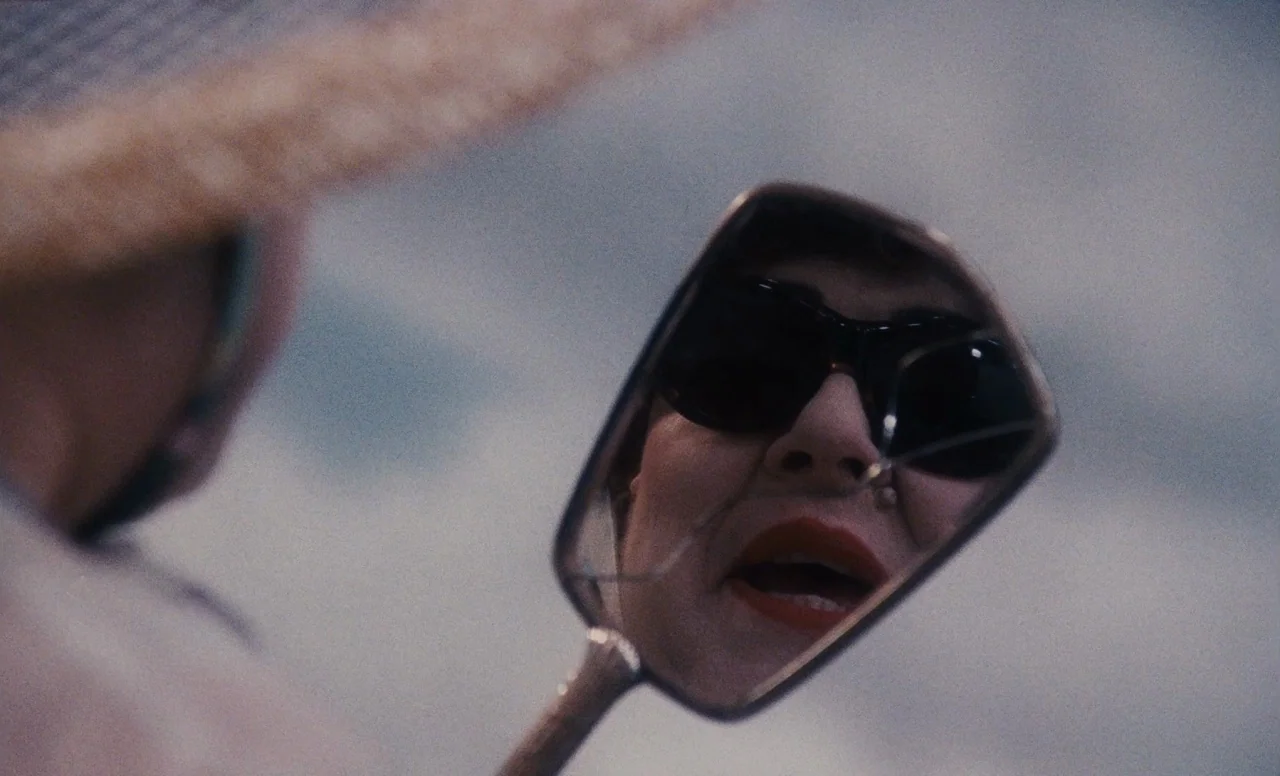 James and the Giant Peach (1996) movie still: closeup — An outdoor setting captures a reflection in a small polished metal mirror. The subject…