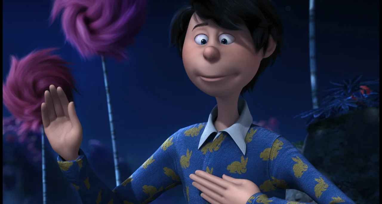 The Lorax (2012) movie still: medium — A nighttime field features fuzzy magenta truffula trees under a dark blue sky. The boy wears a blue patterned…