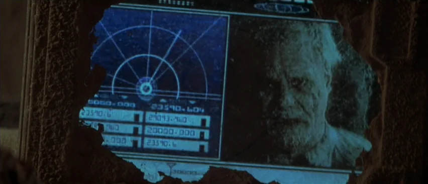 Planet of the Apes (2001) movie still: closeup — An electronic interface with radar graphics and numerical data is displayed on a screen. A man…