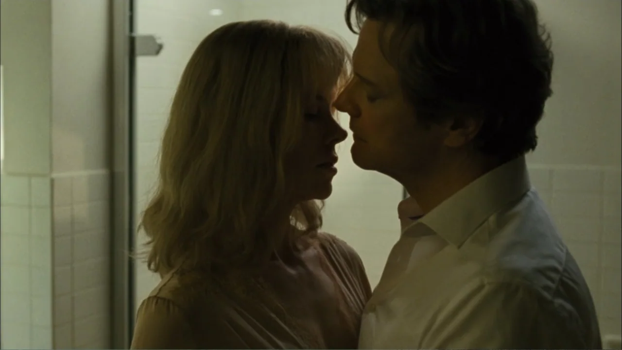 Before I Go to Sleep (2014) movie still: medium — A modern bathroom features off-white square tiles on the wall. A man in a white shirt and a woman…