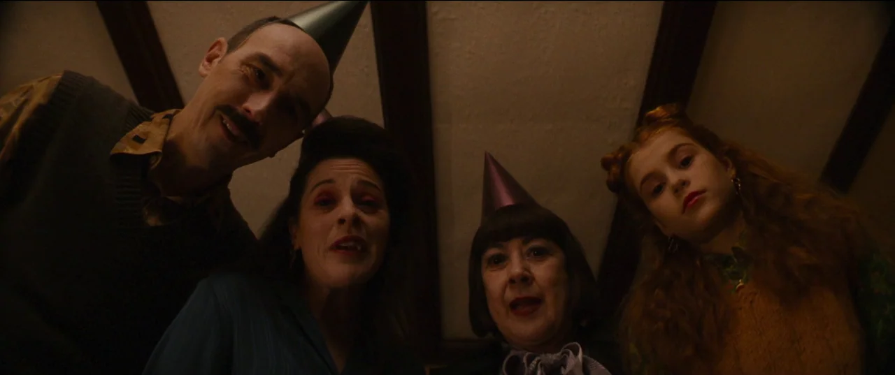 Humanist Vampire Seeking Consenting Suicidal Person (2023) movie still: medium — A group of four people lean over the camera from an overhead…