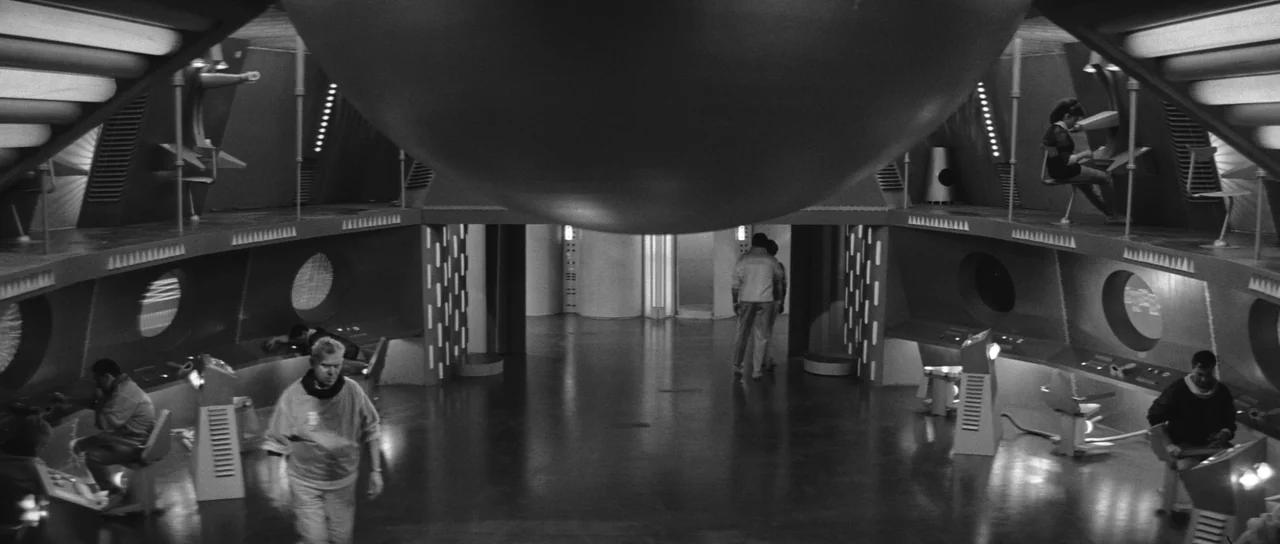 Ikarie XB 1 (1963) movie still: wide — A spacious futuristic control room features curved consoles, rounded portholes, and a large central dome.…