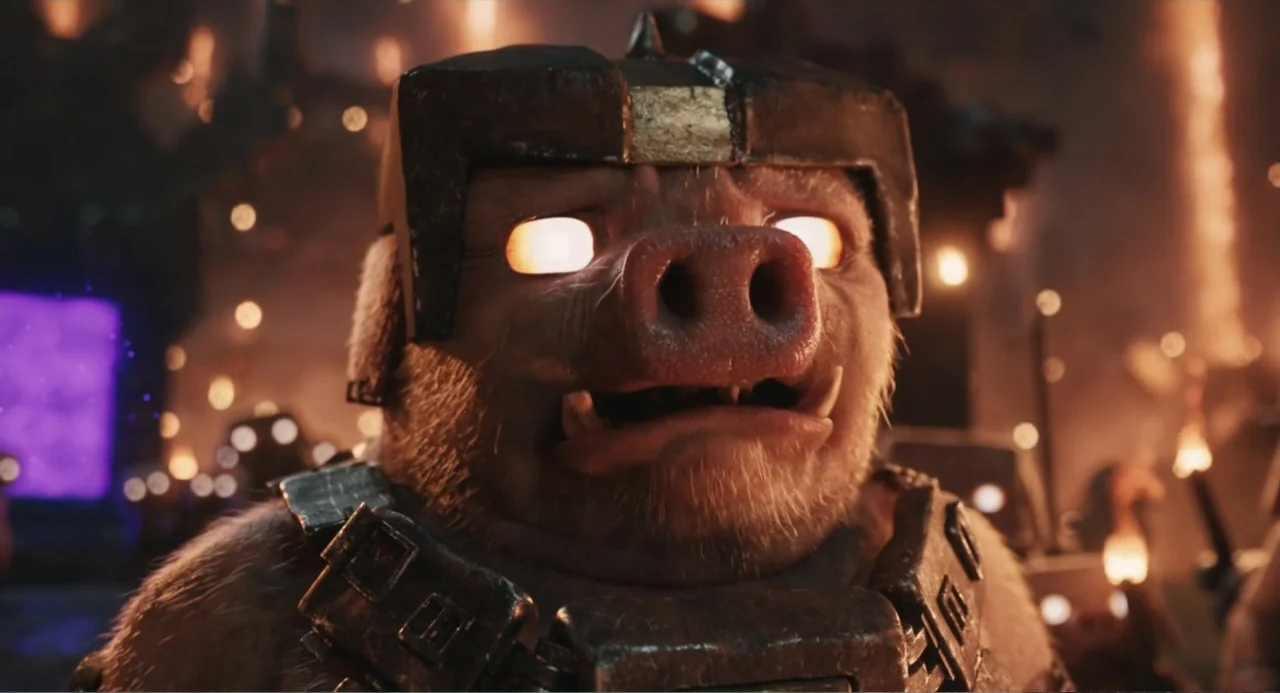 A Minecraft Movie (2025) movie still: closeup — An anthropomorphic pig warrior stands in a dimly lit volcanic environment with lava glows. The…