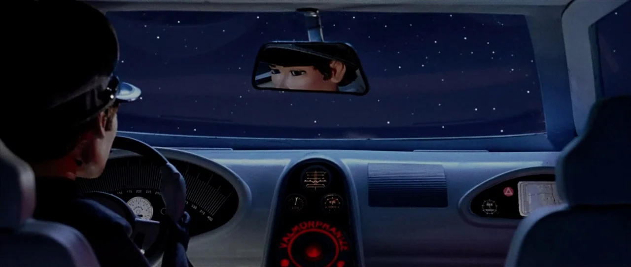Team America: World Police movie still: medium — The interior of a futuristic 1960s puppet-style spaceship cockpit features a minimalist control…