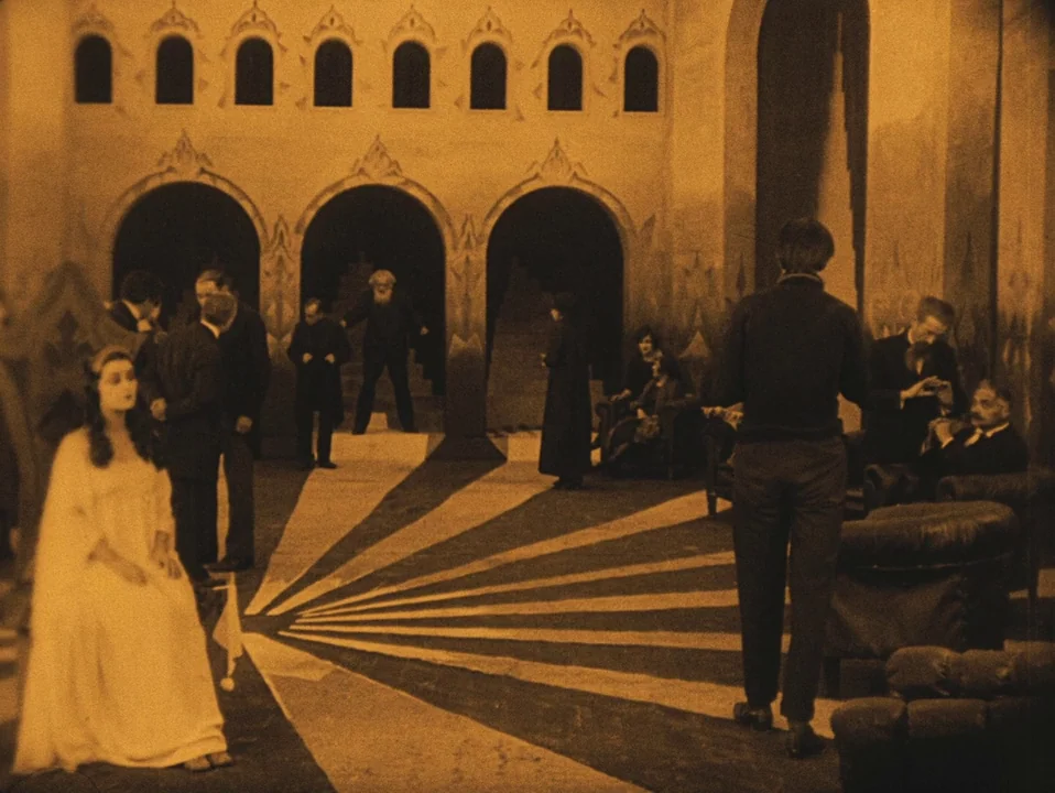 The Cabinet of Dr. Caligari (1920) movie still: wide — A grand, theatrical room features arched doorways and a floor with radiating star-like…