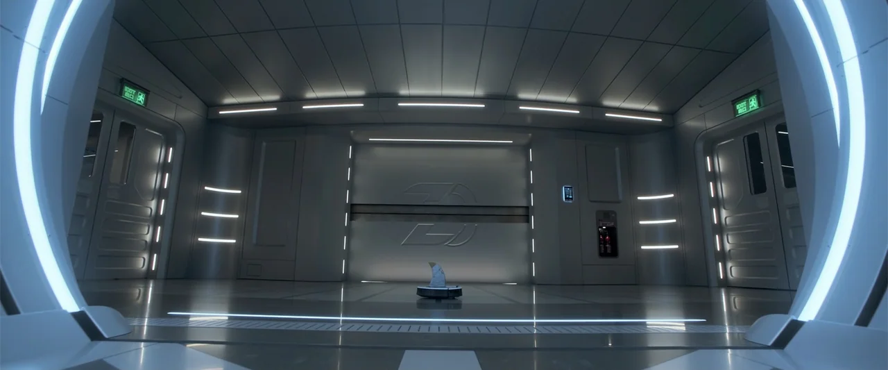 The Meg (2018) movie still: wide — A spacious, sterile room features polished metallic surfaces and illuminated architectural rings at the entrance.…