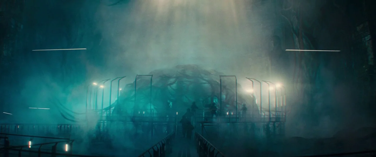 Godzilla: King of the Monsters (2019) movie still: wide — An underground chamber features a massive organic mass encased within a circular metal…