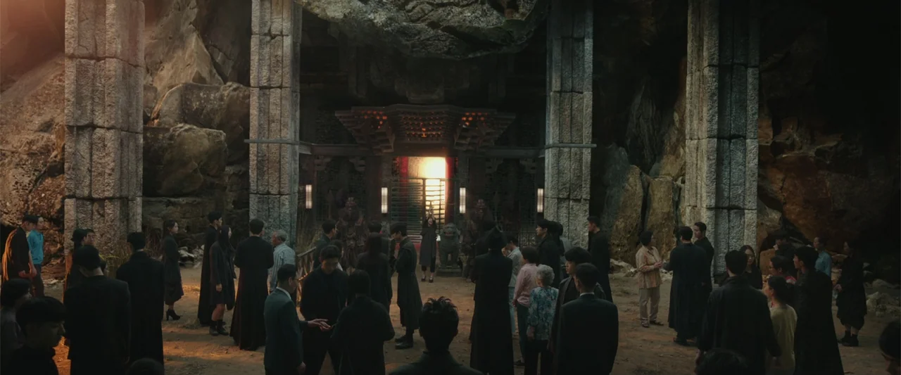 Along with the Gods: The Two Worlds (2017) movie still: wide — A vast cavern features towering stone pillars and a central ornate shrine with…