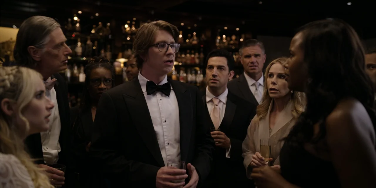 About Fate (2022) movie still: medium — A dimly lit upscale bar with shelves of bottles visible in the blurred background. A group of men and women…