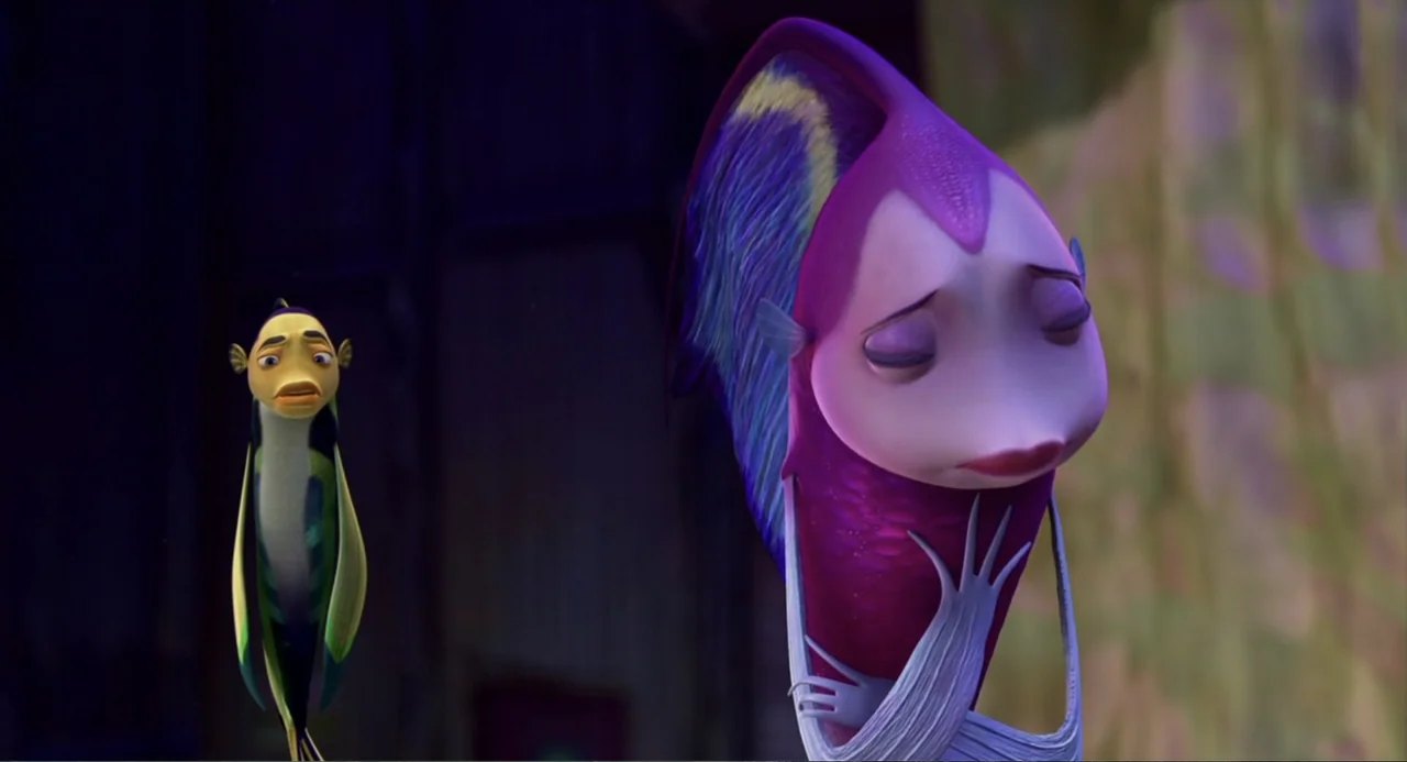 Shark Tale (2004) movie still: medium — An underwater space with a blurred coral reef background and dark shadows. A large purple fish stands in the…