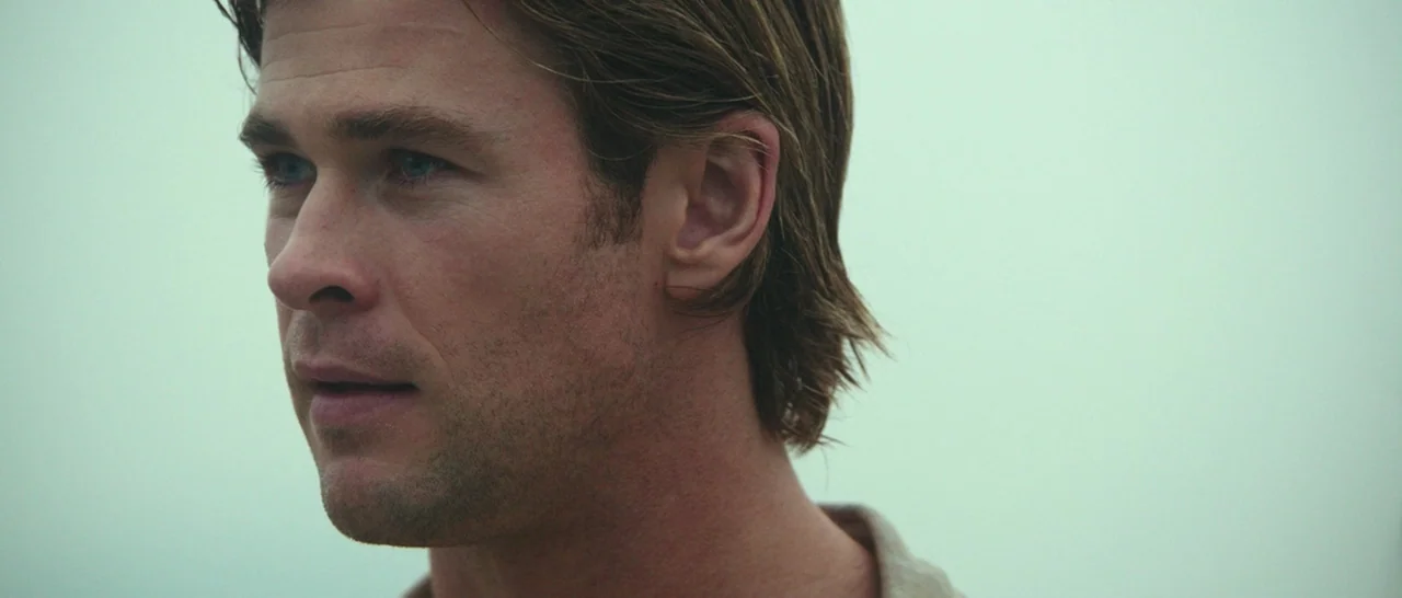 Blackhat (2015) movie still: closeup — A featureless, foggy environment with no horizon line or visible structures. A man is captured in close-up…