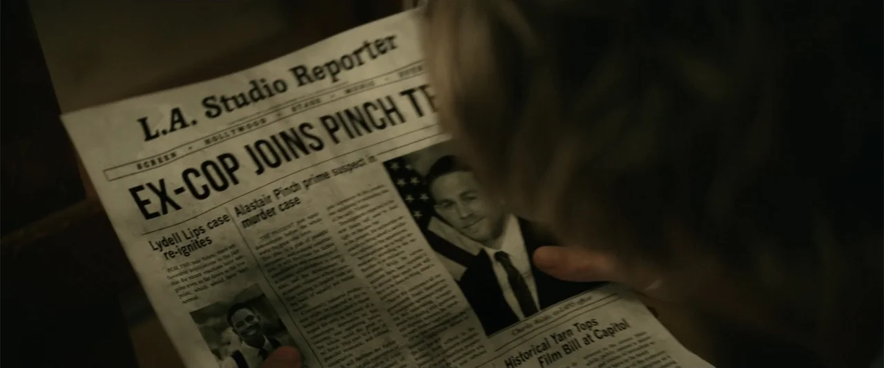 Last Looks (2022) movie still: closeup — A person holds a newspaper featuring a headline about an ex-cop. The newspaper contains text and…