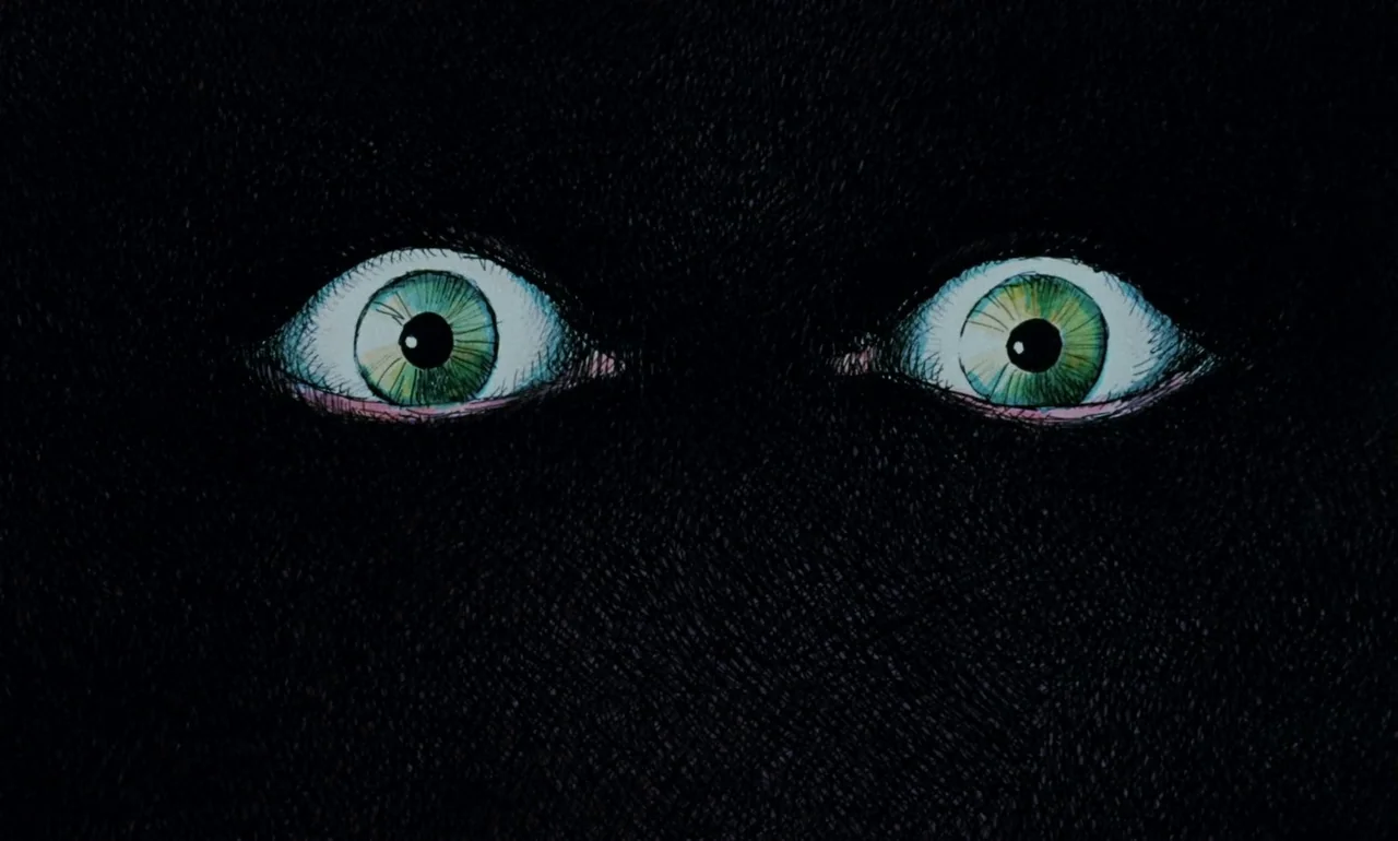 Fantastic Planet (1973) movie still: closeup — A field of solid black is broken only by two wide green eyes. The eyes are rendered in a hand-drawn…