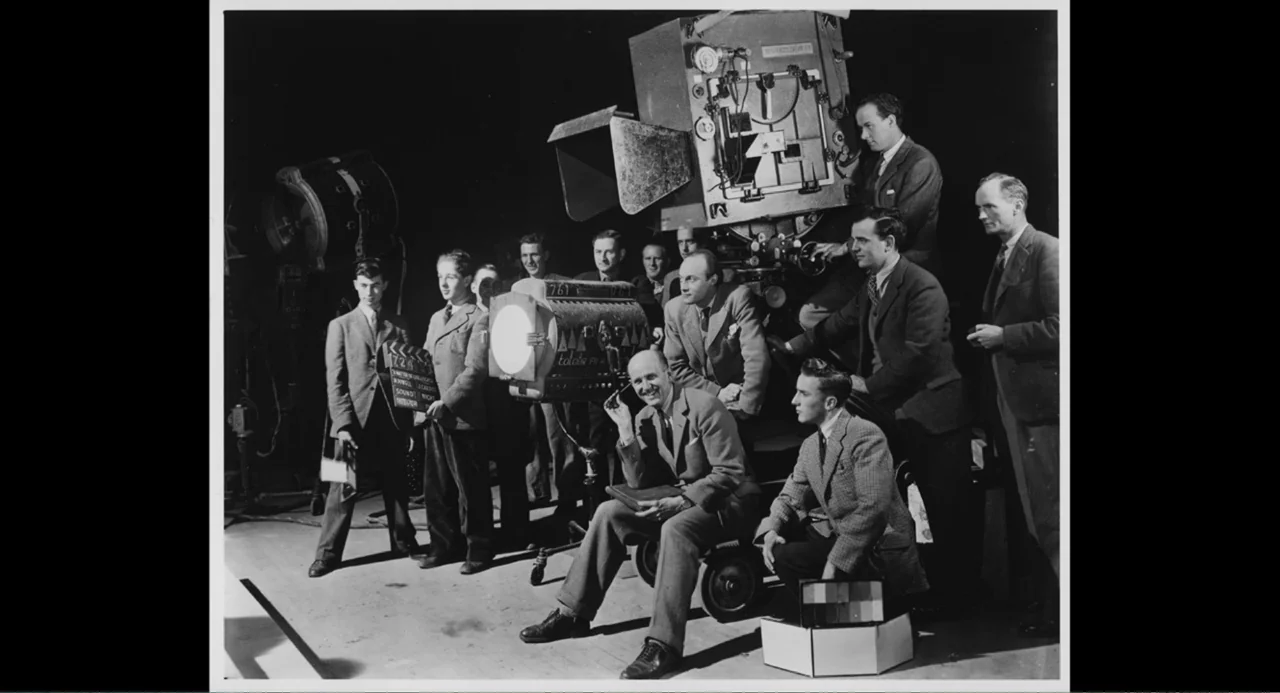 Made in England: The Films of Powell and Pressburger (2024) movie still: wide — A film production crew stands around a large Technicolor camera on a…