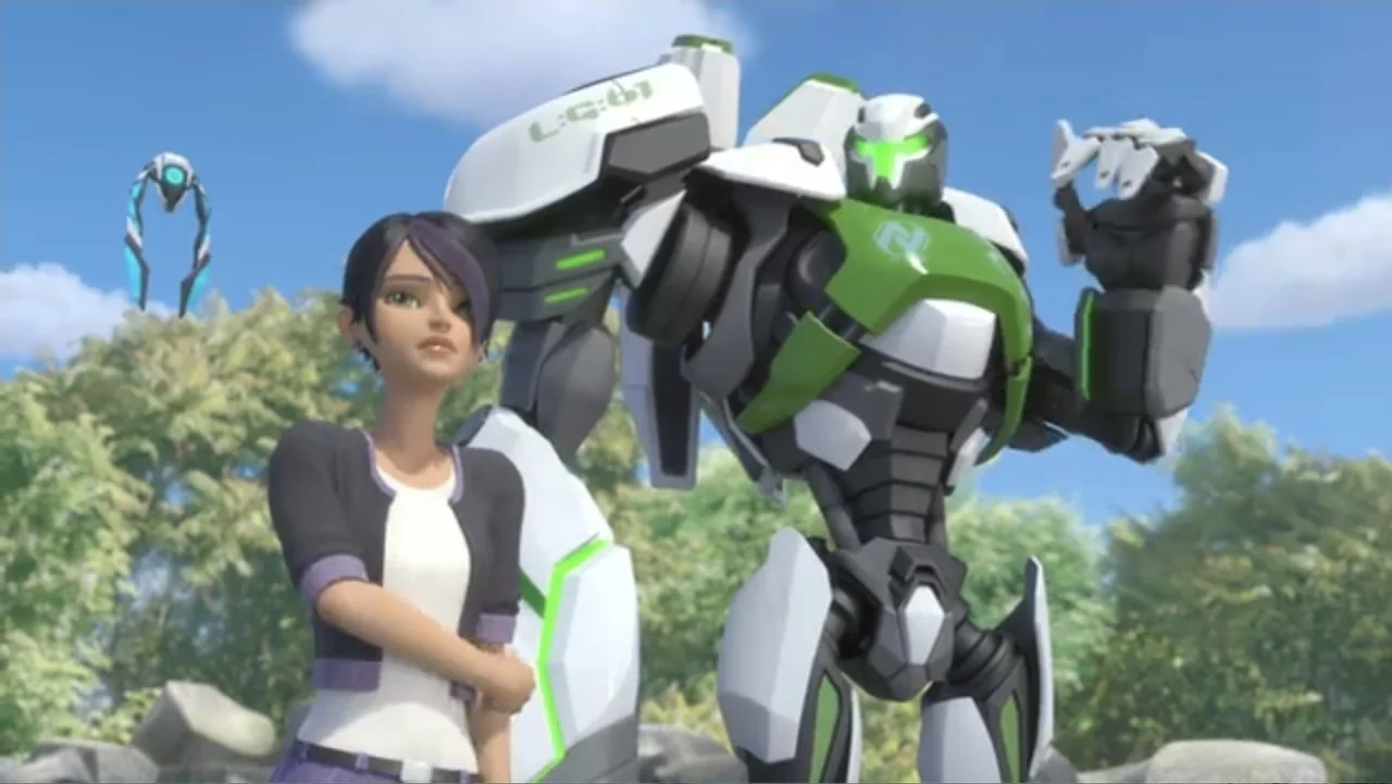Max Steel: Team Turbo (2016) movie still: medium — A sunny outdoor area features large rocks against a background of green trees. A woman stands…
