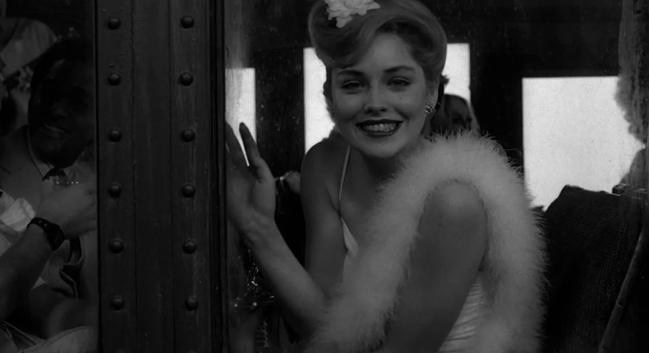 Stardust Memories (1980) movie still: medium — A vintage train compartment features riveted metal walls and windows looking out to light. A woman…