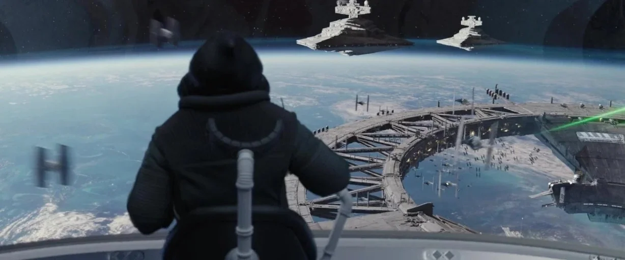 Rogue One: A Star Wars Story (2016) movie still: medium — A dark, futuristic cockpit interior looks out over a curved view of a blue planet. Several…