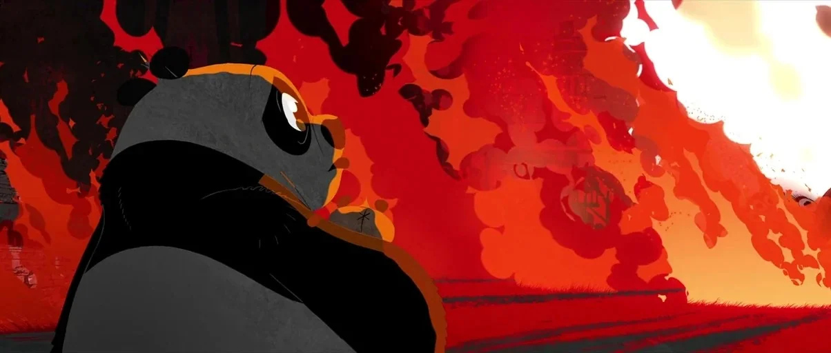 Kung Fu Panda 2 (2011) movie still: medium — A stylized, two-dimensional animated village is consumed by intense flames. A panda stands in the…