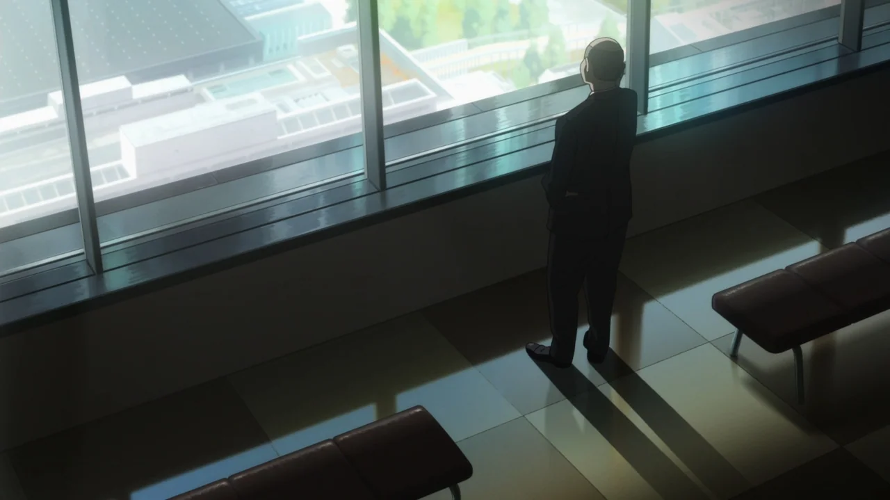 Napping Princess (2017) movie still: fullbody — A modern building waiting room features tile floors and multiple rows of benches. An older man in a…