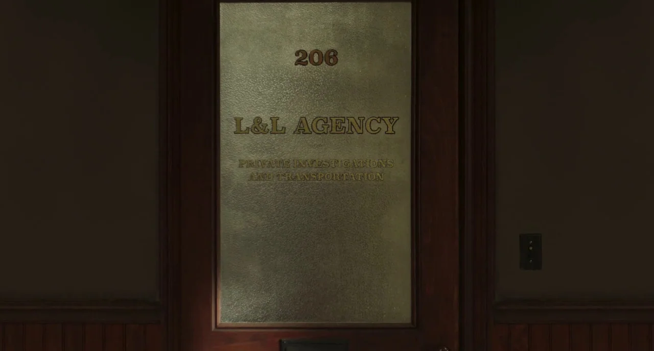 Motherless Brooklyn (2019) movie still: medium — A wooden door features a large frosted glass window with black lettering. The text reads 206 L&L…