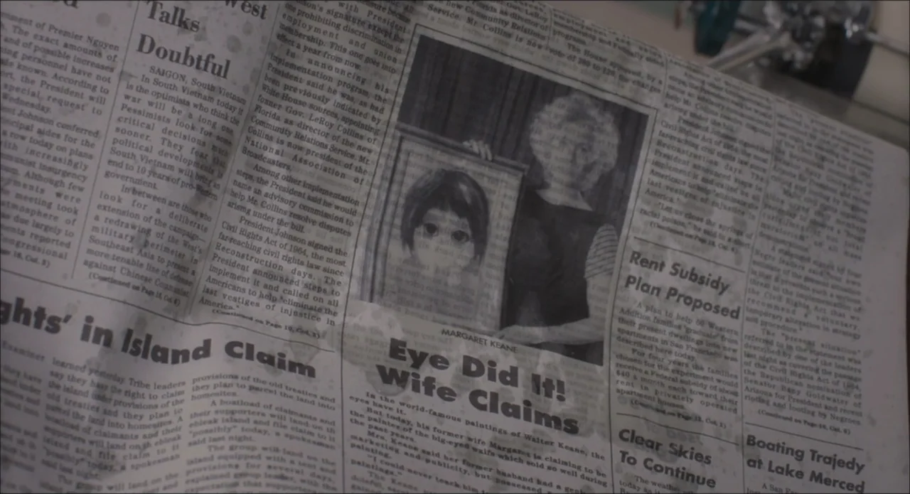 Big Brown Eyes (1936) movie still: closeup — A close-up of a 1960s newspaper column features a headline about Margaret Keane. The printed article…