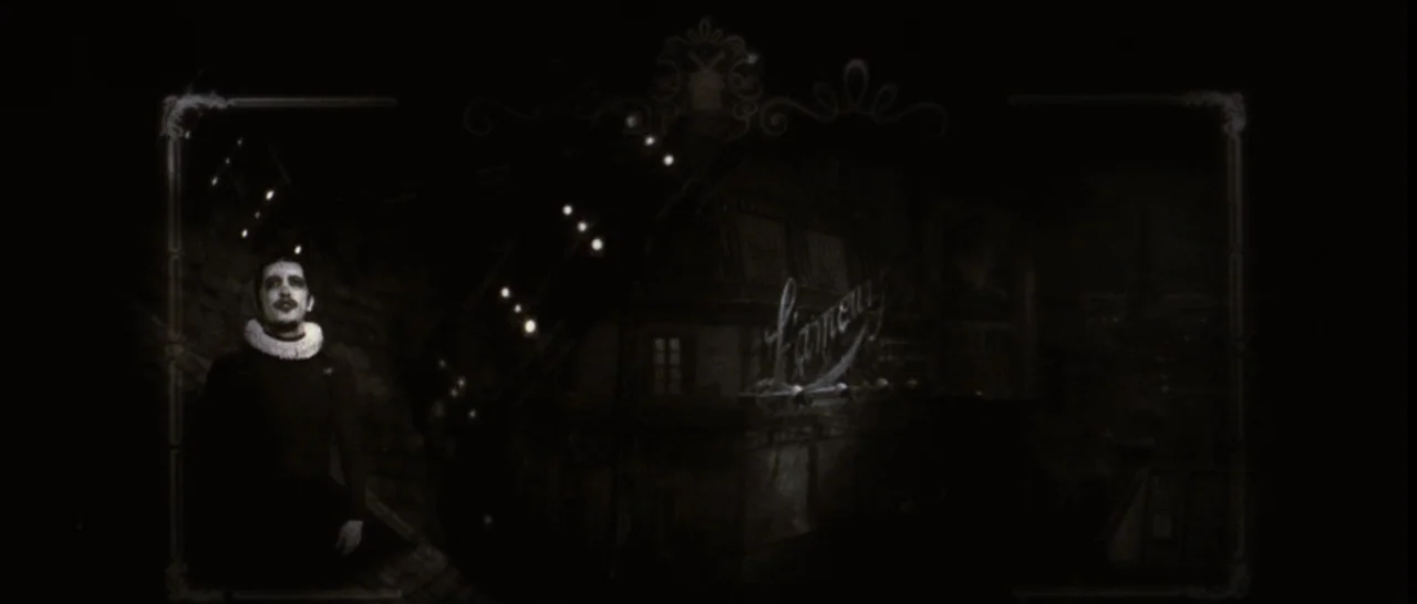 Moulin Rouge! (2001) movie still: wide — A person sits on a dark rooftop against a backdrop of glowing window lights. An ornate frame border…