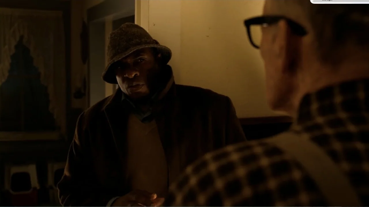 Chain Letter (2010) movie still: medium — The interior of a dimly lit residential room shows walls and a shadowy window.