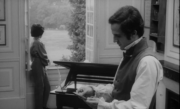 The Wild Child (1970) movie still: medium — A 19th-century study features wooden trim, paneled walls, and a large open casement window. A man in…