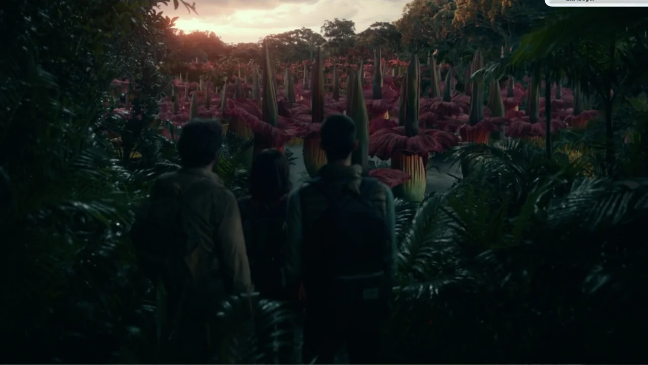 Dora and the Lost City of Gold (2019) movie still: wide — A dense tropical jungle contains a vast clearing filled with oversized red-petaled…