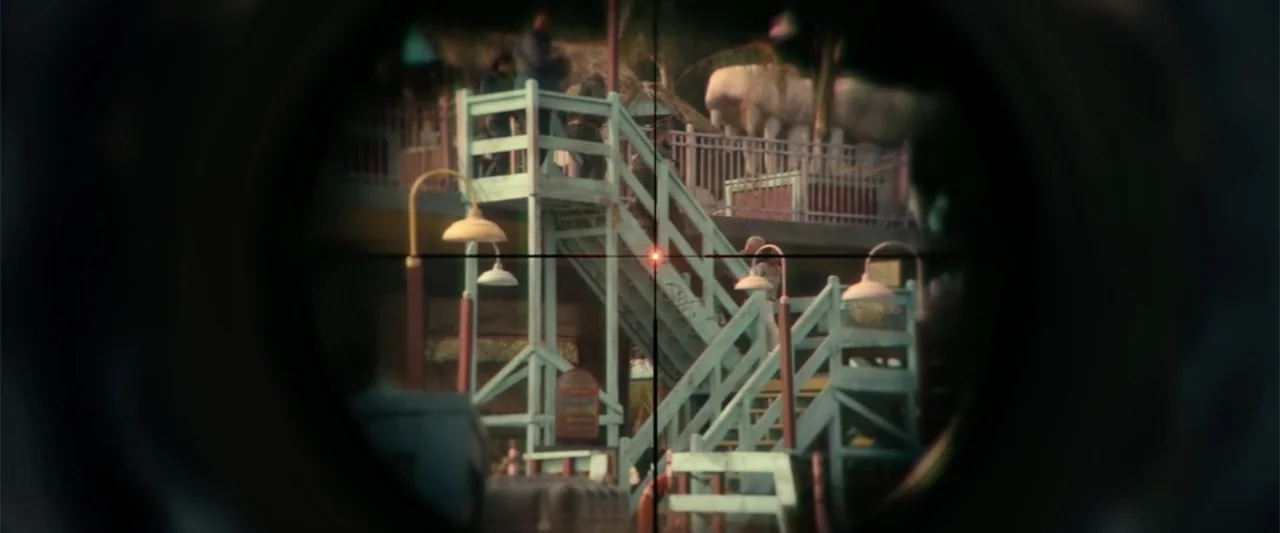 Bad Boys: Ride or Die (2024) movie still: medium — A light blue wooden lifeguard tower stands at night viewed through a circular scope. The…