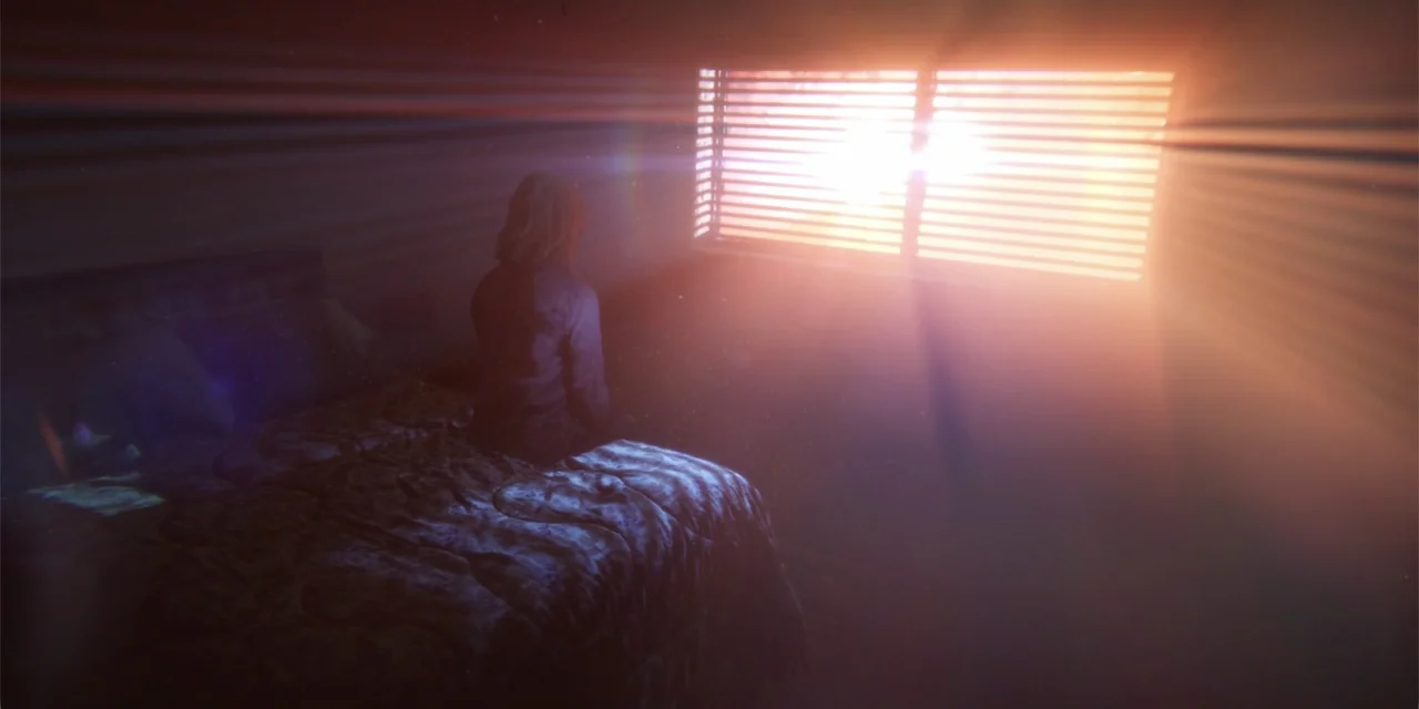 Demonic (2015) movie still: medium — A dark, dimly lit room contains a bed with a patterned comforter. A person sits on the mattress facing a window…