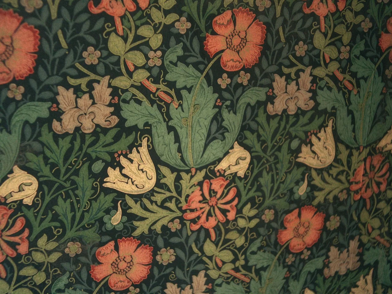 I’m Thinking of Ending Things (2020) movie still: closeup — A close-up view shows a repeating Victorian-style floral wallpaper pattern. Deep green…