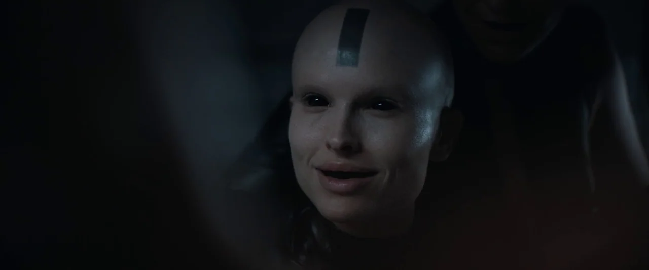 Dune: Part 2 (2024) movie still: closeup — A dark, undifferentiated interior space obscures all environmental details except for the subject's head.…