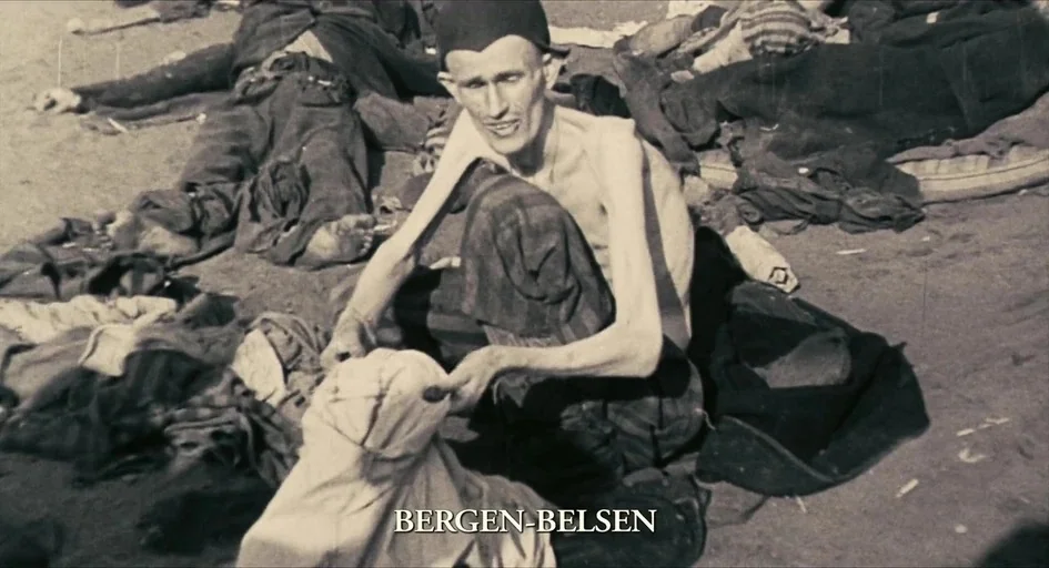 The Last Days (1998) movie still: medium — An open dirt ground at the Bergen-Belsen camp features numerous bodies lying on the earth. A single man…