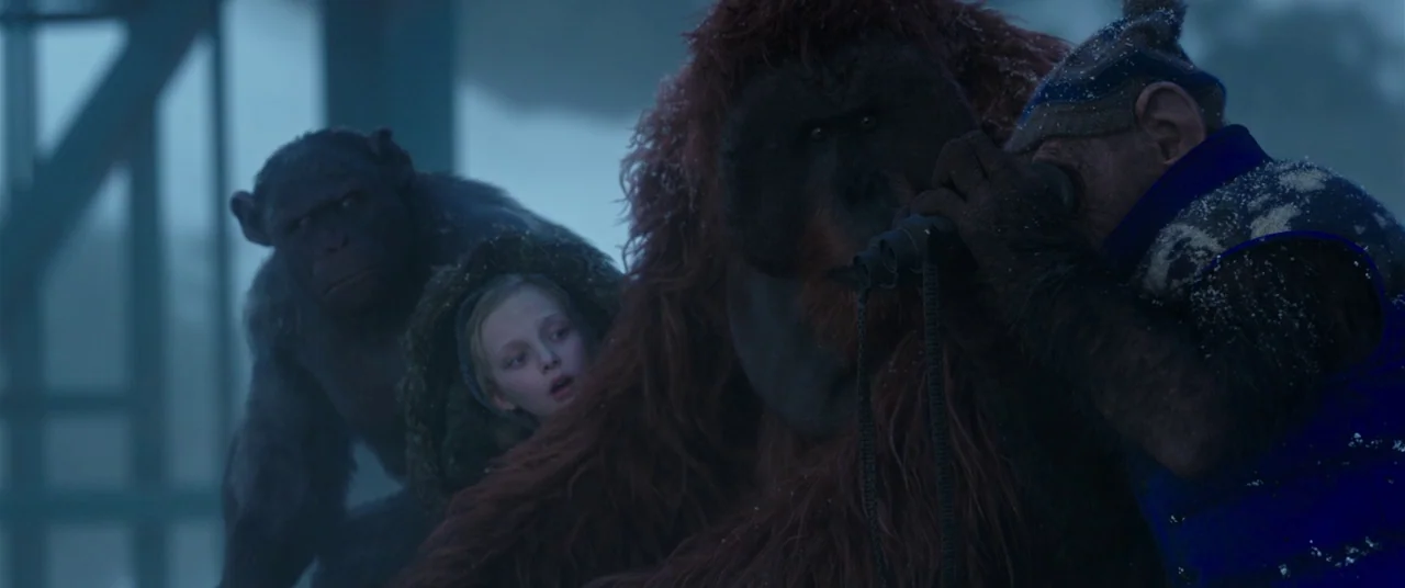War for the Planet of the Apes (2017) movie still: medium — An orangutan, two chimpanzees, and a young human child gather in a foggy environment.…