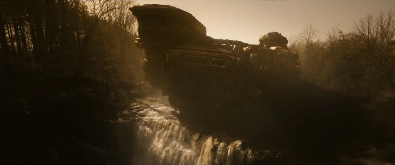 Star Trek: Section 31 (2025) movie still: wide — A massive weathered metallic spaceship rests on a rocky ledge above a cascading waterfall. The…