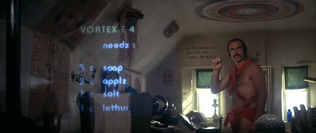 Zardoz (1974) movie still: medium — An attic with sloped walls contains a floating digital shopping list projection. A man in a loincloth stands in…