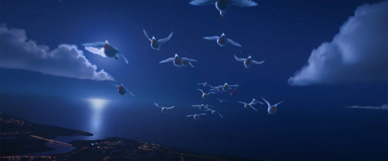 Migration (2023) movie still: wide — A night sky above a dark sea with a distant coastline visible below. A small flock of geese flies towards the…
