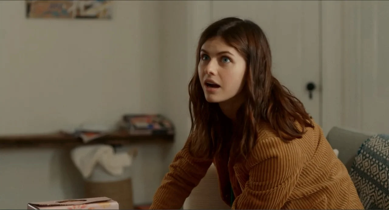 Can You Keep a Secret? (2019) movie still: medium — A modern domestic interior features white walls and a wooden shelf in the background. A woman…