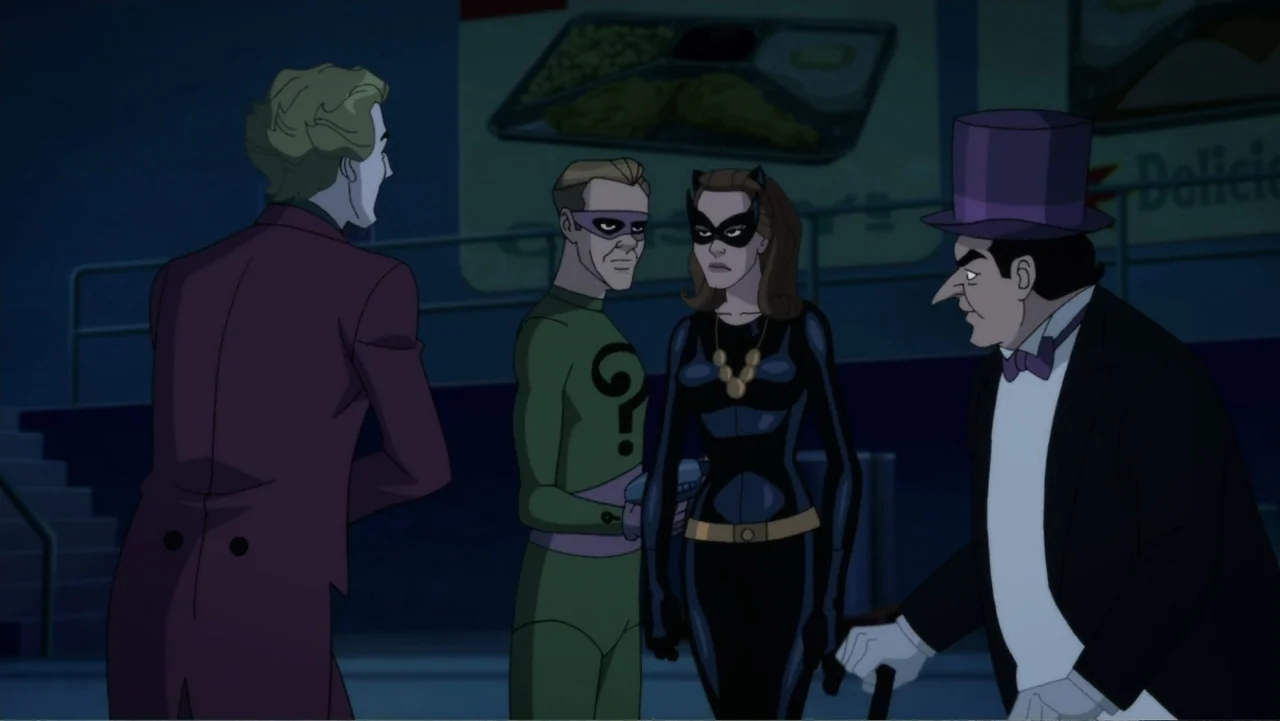 Batman: Return of the Caped Crusaders (2016) movie still: medium — A dimly lit indoor space features four costumed characters standing near a food…